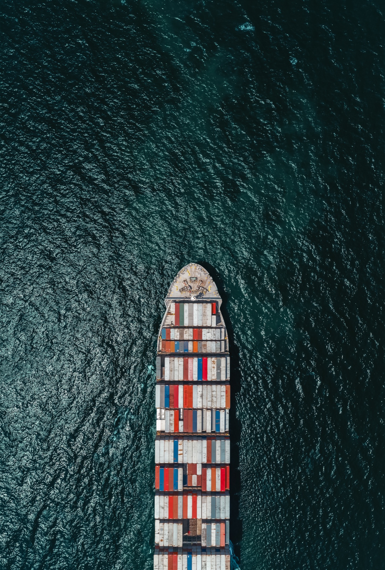 An aerial view of a container ship at sea