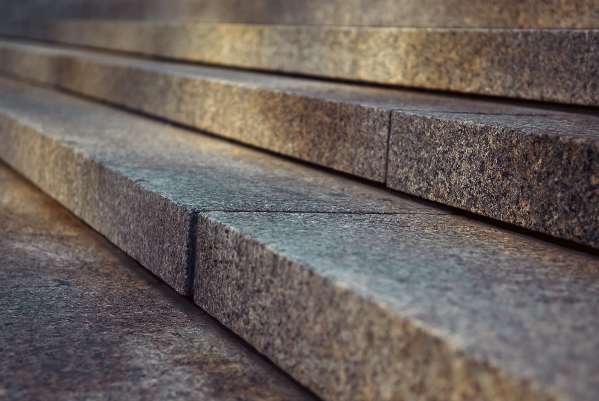A close, diagonal view of layered stone steps